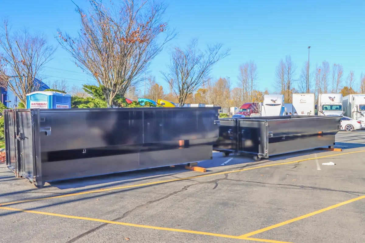 Professional dumpster rental service with roll-off container on residential driveway in Wrightsboro